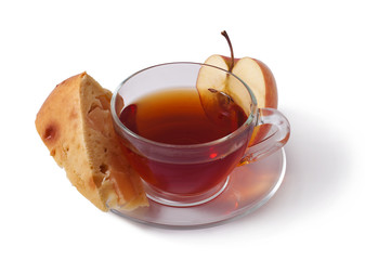 tea in a transparent cup and apple charlotte isolated on white background 