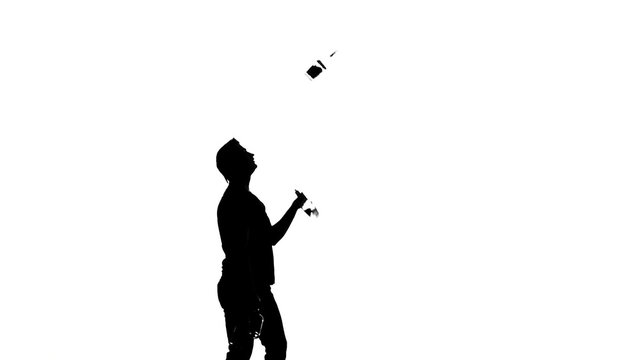 bartender man on a white background. silhouette. slow motion