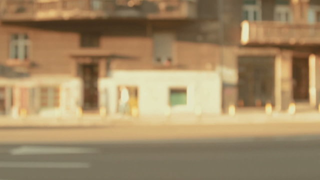 Defocused city traffic in slow motion 2x.
