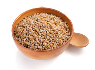 buckwheat in bowl isolated on white
