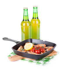Grilled shrimps on frying pan and beer