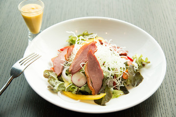  Salad with arugula and duck breast.