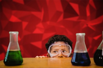 Composite image of cute pupil dressed up as scientist