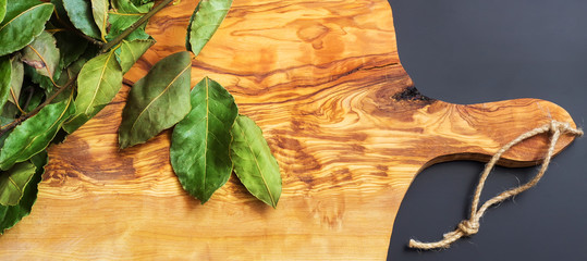 Green bay leaf on wooden texture
