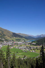 Fototapeta na wymiar View From Mt. Jakobshorn Down To Davos & Lake Davos In Graubünden In Switzerland In Summer