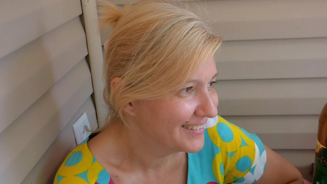 A young woman tells a funny story