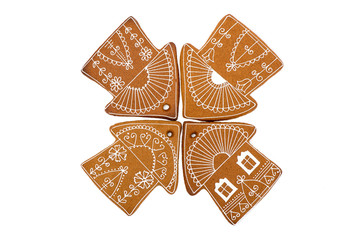 Christmas Gingerbread. Home-baked and decorated gingerbread on white background.