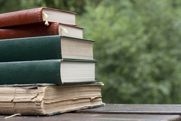 old books on a garden table