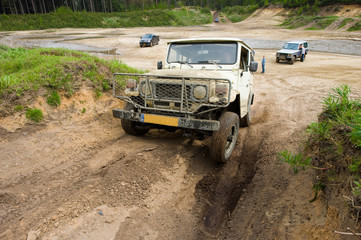 Obraz na płótnie Canvas Four wheel drive on muddy track