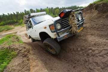 Fototapeta na wymiar Four wheel drive on muddy track