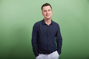 the young man in a black shirt on a green background