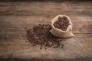Roasted coffee beans in burlap sack, coffee beans in burlap bag