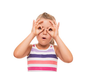 little girl standing on white background and pretending that hol