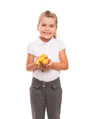 little girl standing against white backdrop with three fresh ban