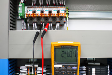 Digital multimeter checking voltage