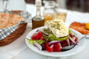 Greek salad with country bread and home made white wine
