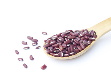 Red beans on wooden spoon isolated on white background