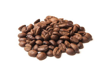 heap of roasted coffee beans on white