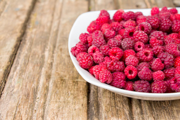 Plate of fresh red raspberry.
