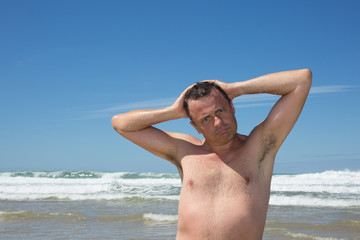 Man having fun at the beach during summertime