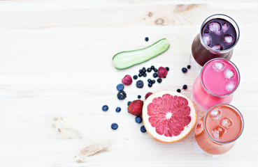 Fresh colorful lemonade (pink, purple, orange)  in glasses