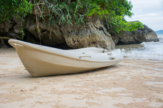Kayak on the beach with mountains