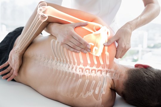 Highlighted bones of man at physiotherapy