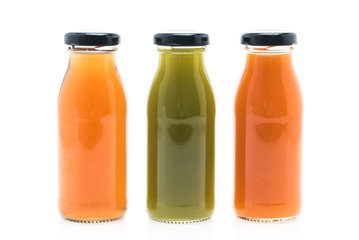 Fototapeta na wymiar Fruit and vegetable juice bottles isolated on white background