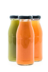 Fruit and vegetable juice bottles isolated on white background