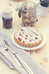 Homemade pie with coffee on a wooden background. Tonned photo