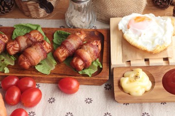Grilled sausages wrapped in bacon fat of delicious.