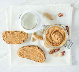 Peanut butter on wooden background.