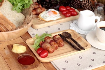 Grilled sausages wrapped in bacon fat of delicious.