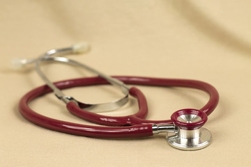 Stethoscope on red background