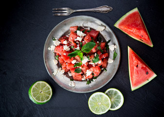 Fresh salad with water-melon, feta cheese, lime and mint.