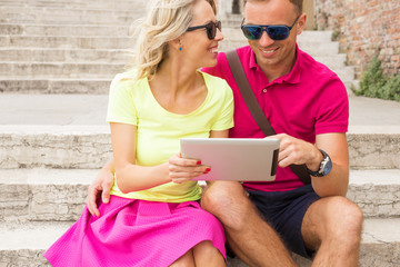 Couple using tablet computer