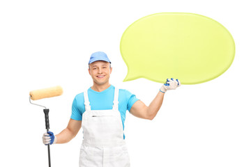 Confident house decorator holding speech bubble