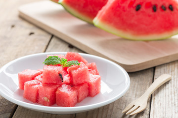 Fresh watermelon on white plate.