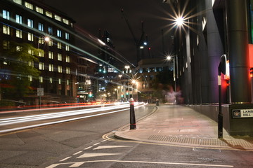 Fototapeta na wymiar Urban city night shot on London street, artistic long exposure shot