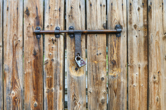 Wooden gate with iron lock