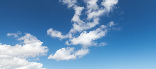 Blue sky with white altocumulus clouds