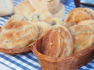 Burek/Boregi - traditional Turkish and Balkan specialty (baked puff pastry filled with meat, potatoes, cheese, or cabbage filling). Offered at farmers market in Prague. 