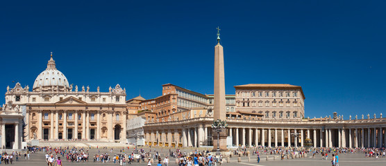 Fototapeta na wymiar St. Peter's Square - is a massive plaza located directly in front of St. Peter's Basilica, the papal enclave inside Rome, west of the neighborhood or rione of Borgo