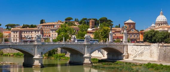 Obraz premium Ponte Vittorio Emanuele II is a bridge in Rome, constructed in 1886 by the architect Ennio De Rossi. It is decorated with high socles carrying colossal bronze winged Victories