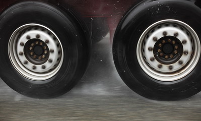 truck wheels on road aquaplaning