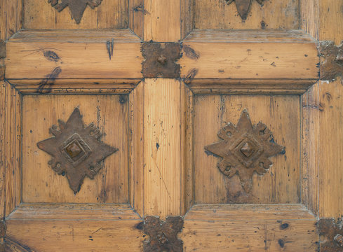 Carved wooden door of an old metal
