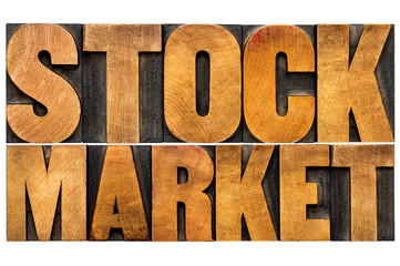 stock market text in wood type