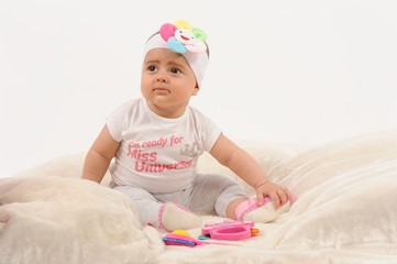Cute and happy newborn baby playing, smiling, laughing with great pose