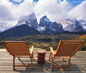 The lounge chairs on wooden platform