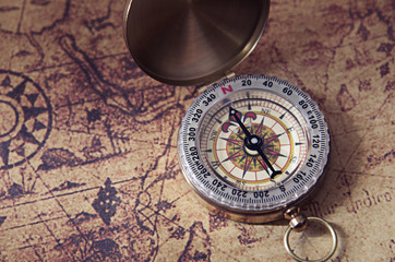 Obraz na płótnie Canvas Compass on old map